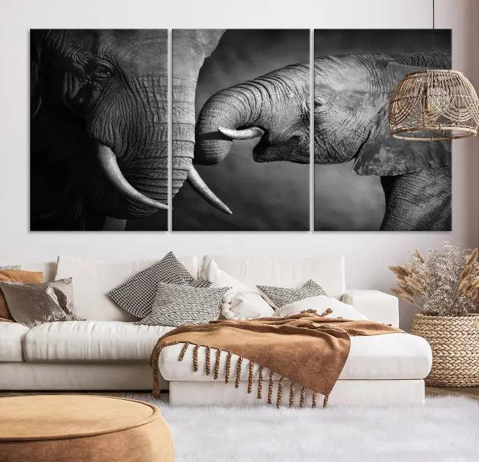 The "Elephant Family Wall Art Canvas Print" is a black-and-white triptych depicting elephants touching trunks, crafted on museum-quality canvas with a UV-protective coating. This ready-to-hang piece adds an elegant touch to any room.