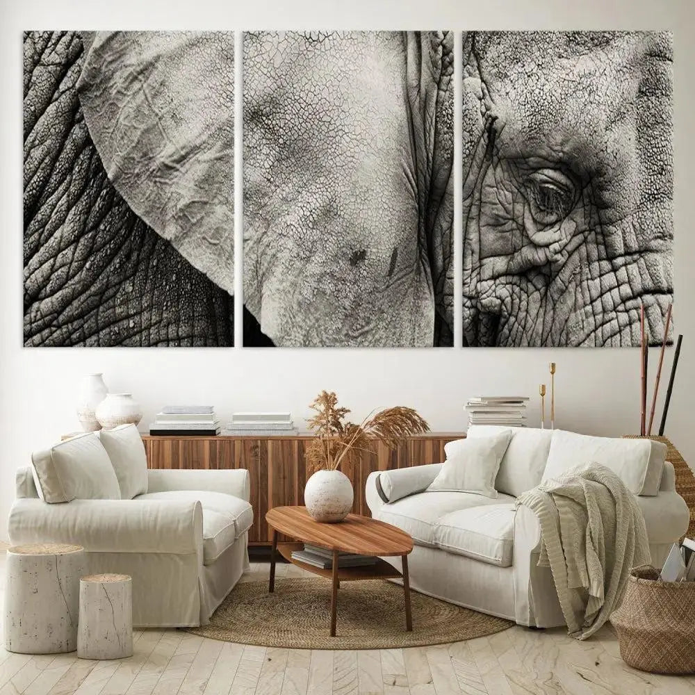 A modern living room features a large Elephant Wall Art Canvas Print in black and white, crafted on museum-quality canvases with UV-protective coating to maintain its elegance.