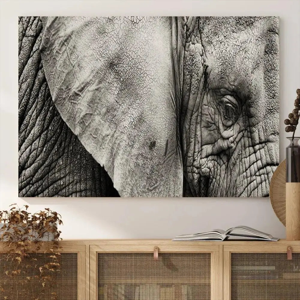 A modern living room features a large Elephant Wall Art Canvas Print in black and white, crafted on museum-quality canvases with UV-protective coating to maintain its elegance.