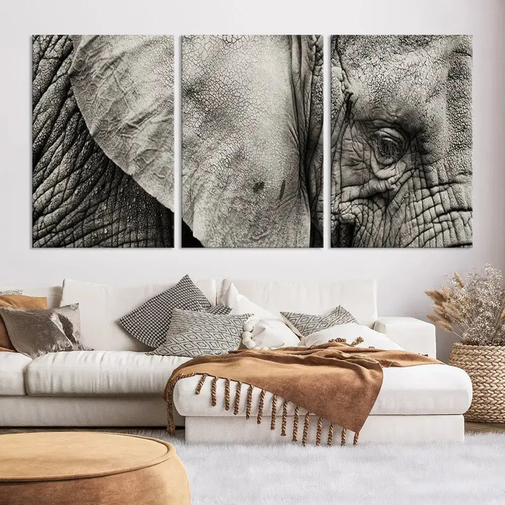 A modern living room features a large Elephant Wall Art Canvas Print in black and white, crafted on museum-quality canvases with UV-protective coating to maintain its elegance.