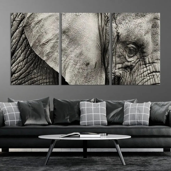 A modern living room features a large Elephant Wall Art Canvas Print in black and white, crafted on museum-quality canvases with UV-protective coating to maintain its elegance.