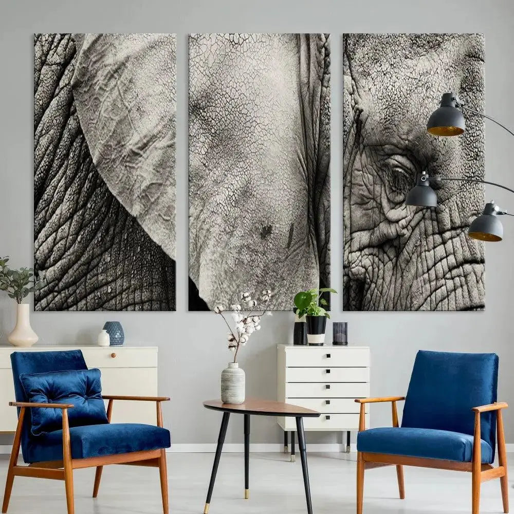 A modern living room features a large Elephant Wall Art Canvas Print in black and white, crafted on museum-quality canvases with UV-protective coating to maintain its elegance.