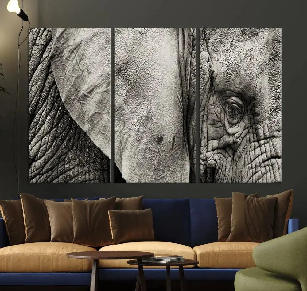 A modern living room features a large Elephant Wall Art Canvas Print in black and white, crafted on museum-quality canvases with UV-protective coating to maintain its elegance.