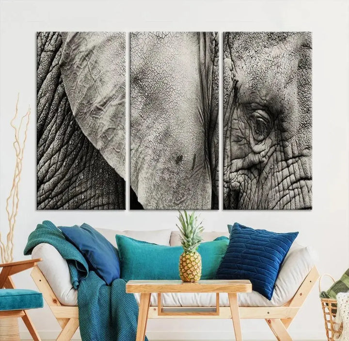 A modern living room features a large Elephant Wall Art Canvas Print in black and white, crafted on museum-quality canvases with UV-protective coating to maintain its elegance.