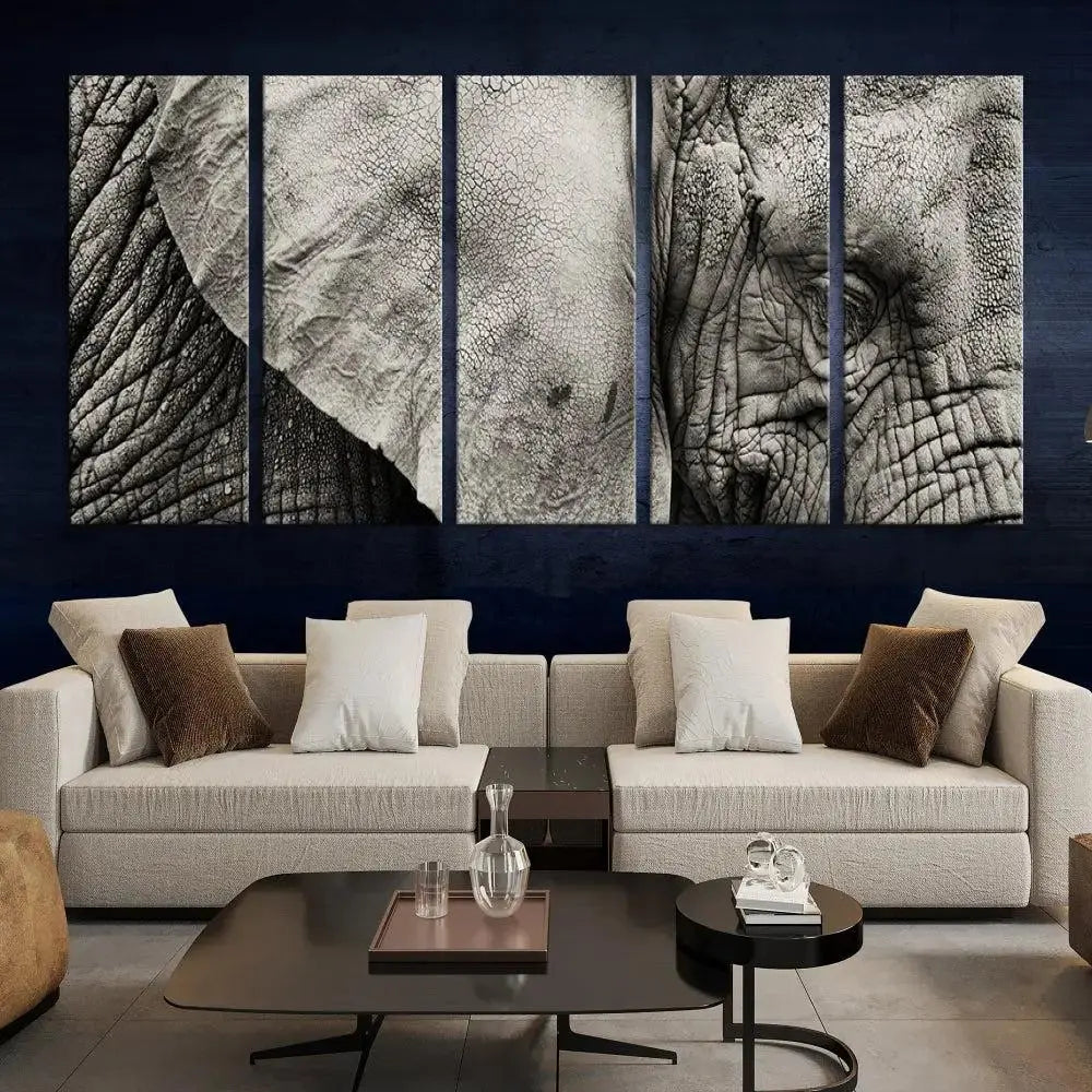 A modern living room features a large Elephant Wall Art Canvas Print in black and white, crafted on museum-quality canvases with UV-protective coating to maintain its elegance.