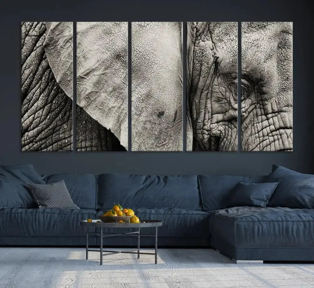 A modern living room features a large Elephant Wall Art Canvas Print in black and white, crafted on museum-quality canvases with UV-protective coating to maintain its elegance.