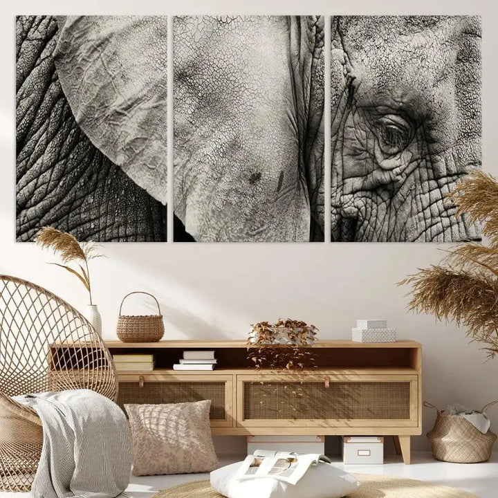 A modern living room features a large Elephant Wall Art Canvas Print in black and white, crafted on museum-quality canvases with UV-protective coating to maintain its elegance.