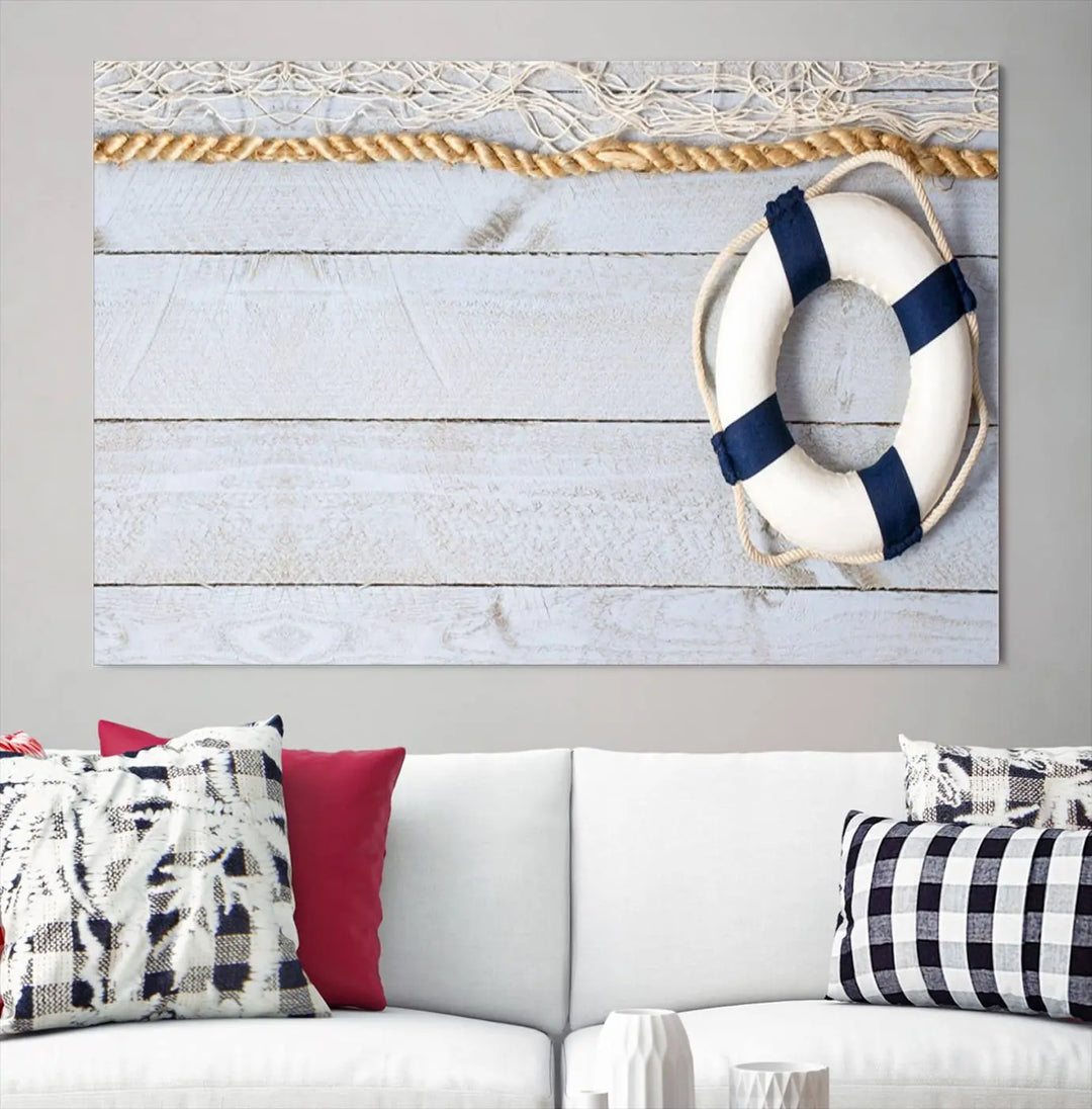 A triptych of the Fancy Lifebuoy and rope on museum-quality canvas with UV-protective coating hangs above.