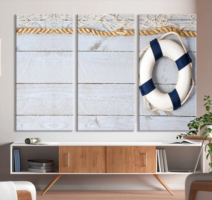 A triptych of the Fancy Lifebuoy and rope on museum-quality canvas with UV-protective coating hangs above.