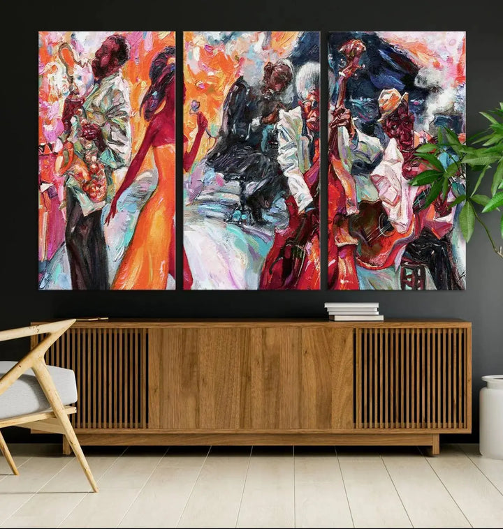 The Fantastic Abstract Jazz Band Music Canvas Wall Art Prints, featuring a UV-protective coating and crafted on museum-quality canvas, hang against a dark wall. These vibrant pieces come ready to hang and infuse an artistic flair into the living space.