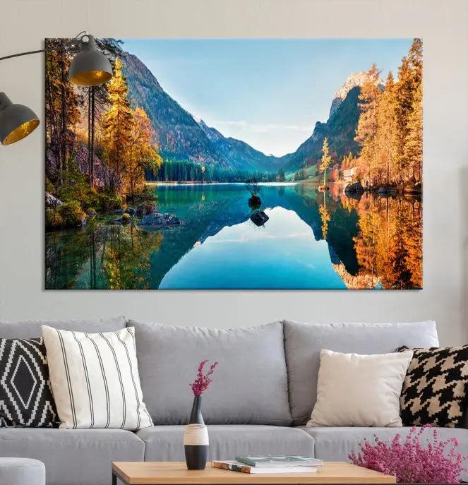 The focal point of the room is the "Fantastic Autumn Panorama Wall Art Canvas Print," a triptych depicting a serene lake and mountains, printed on museum-quality canvas and ready to hang.