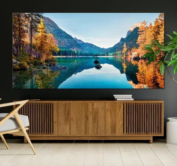 The focal point of the room is the "Fantastic Autumn Panorama Wall Art Canvas Print," a triptych depicting a serene lake and mountains, printed on museum-quality canvas and ready to hang.