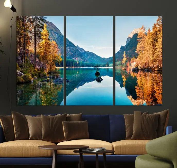 The focal point of the room is the "Fantastic Autumn Panorama Wall Art Canvas Print," a triptych depicting a serene lake and mountains, printed on museum-quality canvas and ready to hang.