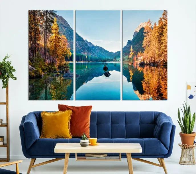 The focal point of the room is the "Fantastic Autumn Panorama Wall Art Canvas Print," a triptych depicting a serene lake and mountains, printed on museum-quality canvas and ready to hang.