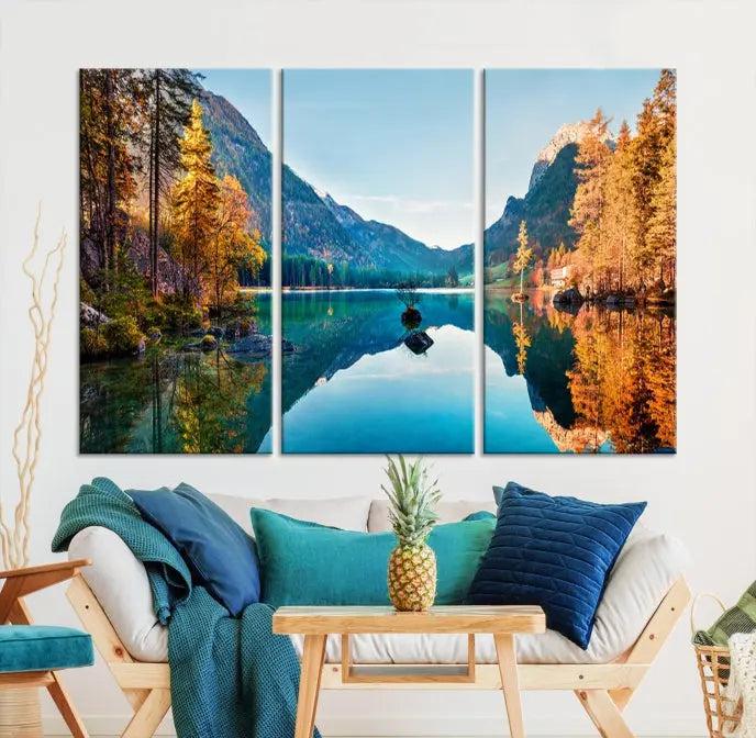 The focal point of the room is the "Fantastic Autumn Panorama Wall Art Canvas Print," a triptych depicting a serene lake and mountains, printed on museum-quality canvas and ready to hang.