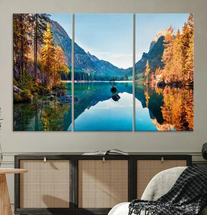 The focal point of the room is the "Fantastic Autumn Panorama Wall Art Canvas Print," a triptych depicting a serene lake and mountains, printed on museum-quality canvas and ready to hang.