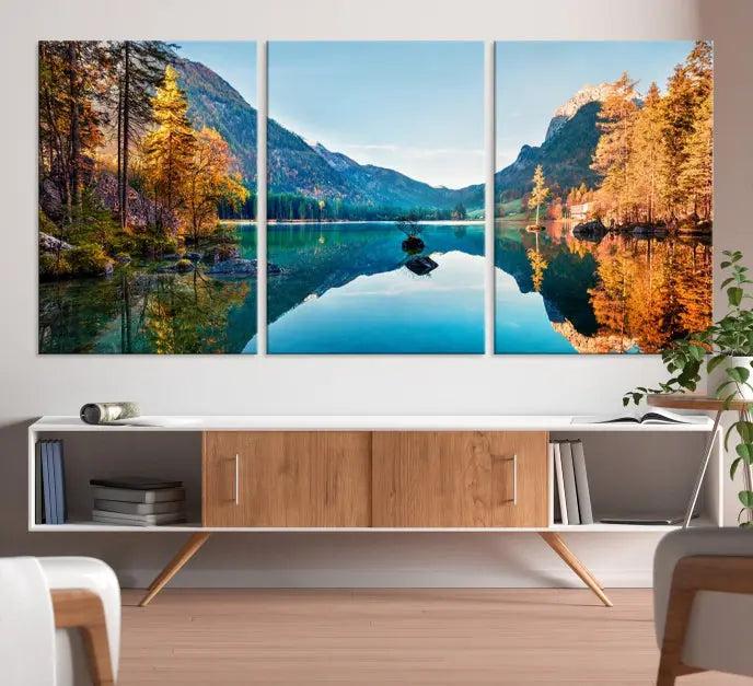 The focal point of the room is the "Fantastic Autumn Panorama Wall Art Canvas Print," a triptych depicting a serene lake and mountains, printed on museum-quality canvas and ready to hang.