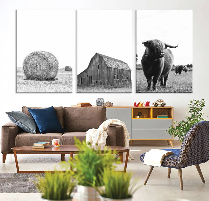 The Farmhouse Wall Art Decor Canvas Print, a triptych artwork, showcases a hay bale, wooden barn, and Highland cow in a meadow. Crafted on museum-quality canvas with neutral tones to create a cozy ambiance, this piece is handcrafted in the USA to enhance any space.