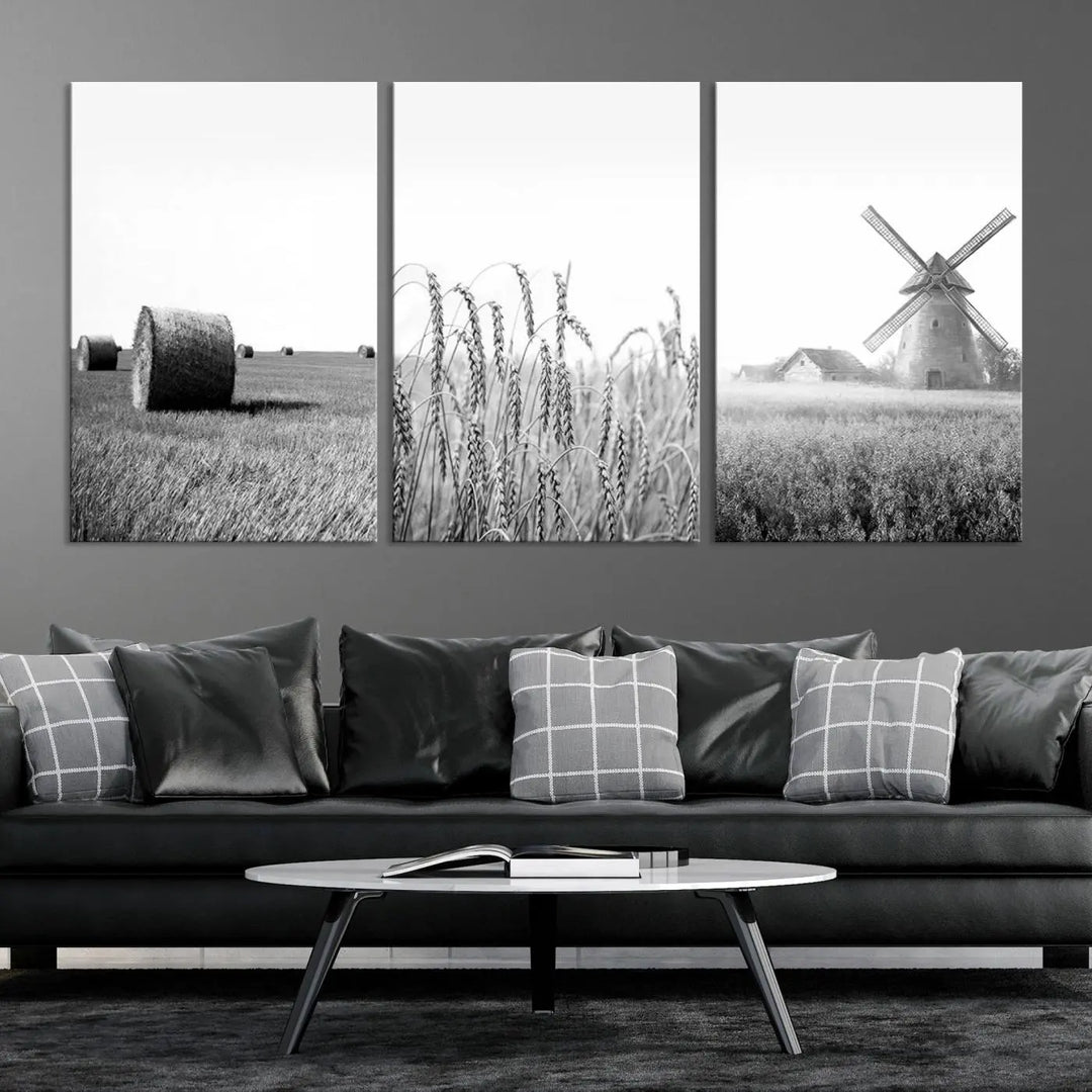 The "Farmhouse Windmill and Wheat Field Black and White 3-Panel Wall Art" brings rustic charm with its depiction of hay bales, wheat, and a windmill. This ready-to-hang canvas print creates an inviting country-inspired atmosphere in any space.