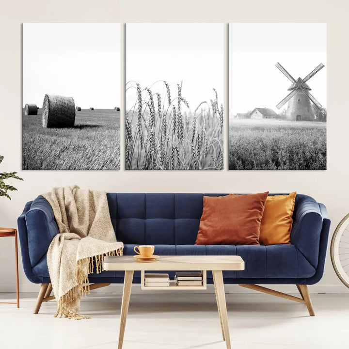 The "Farmhouse Windmill and Wheat Field Black and White 3-Panel Wall Art" brings rustic charm with its depiction of hay bales, wheat, and a windmill. This ready-to-hang canvas print creates an inviting country-inspired atmosphere in any space.