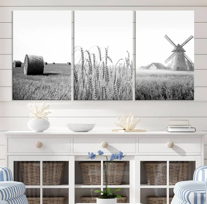 The "Farmhouse Windmill and Wheat Field Black and White 3-Panel Wall Art" brings rustic charm with its depiction of hay bales, wheat, and a windmill. This ready-to-hang canvas print creates an inviting country-inspired atmosphere in any space.