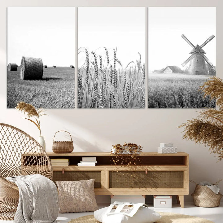 The "Farmhouse Windmill and Wheat Field Black and White 3-Panel Wall Art" brings rustic charm with its depiction of hay bales, wheat, and a windmill. This ready-to-hang canvas print creates an inviting country-inspired atmosphere in any space.