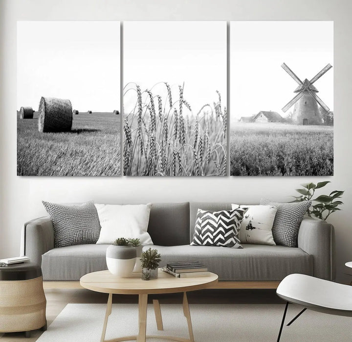 The "Farmhouse Windmill and Wheat Field Black and White 3-Panel Wall Art" brings rustic charm with its depiction of hay bales, wheat, and a windmill. This ready-to-hang canvas print creates an inviting country-inspired atmosphere in any space.