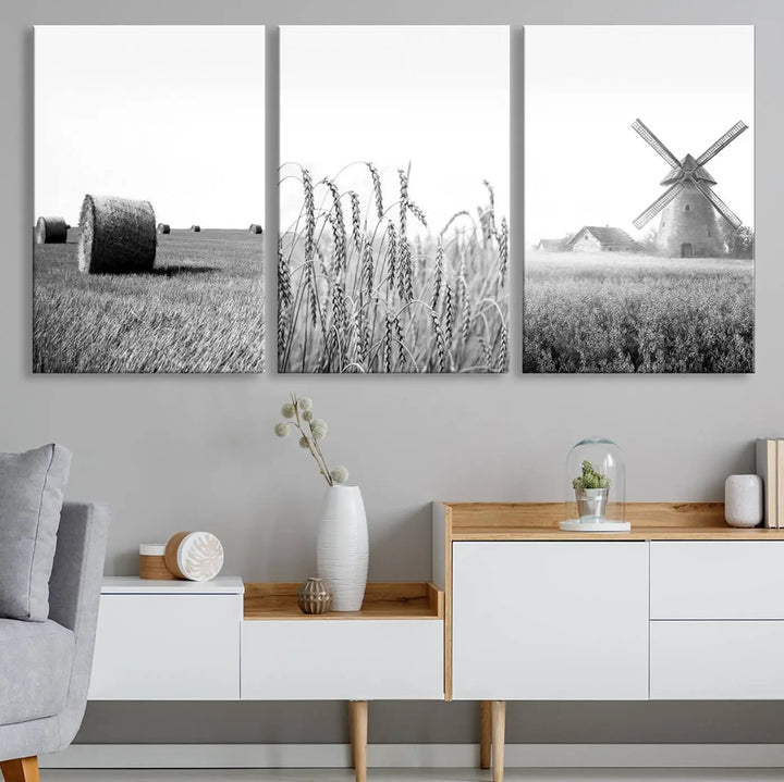 The "Farmhouse Windmill and Wheat Field Black and White 3-Panel Wall Art" brings rustic charm with its depiction of hay bales, wheat, and a windmill. This ready-to-hang canvas print creates an inviting country-inspired atmosphere in any space.