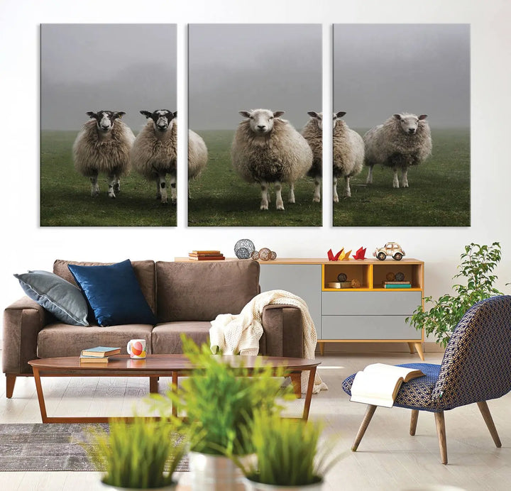 The "Flock of Sheep in a Mystical Fog" pastoral wall art canvas print, framed and ready to hang, adds a touch of farmhouse decor to the room.