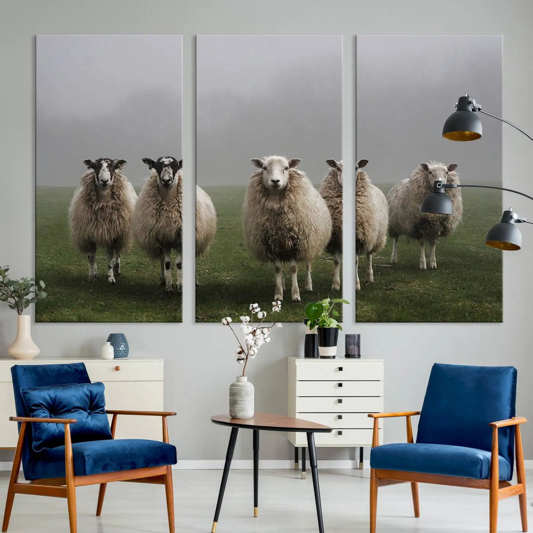 The "Flock of Sheep in a Mystical Fog" pastoral wall art canvas print, framed and ready to hang, adds a touch of farmhouse decor to the room.