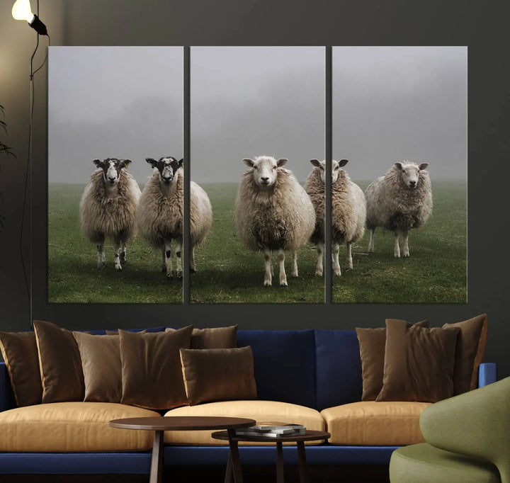 The "Flock of Sheep in a Mystical Fog" pastoral wall art canvas print, framed and ready to hang, adds a touch of farmhouse decor to the room.