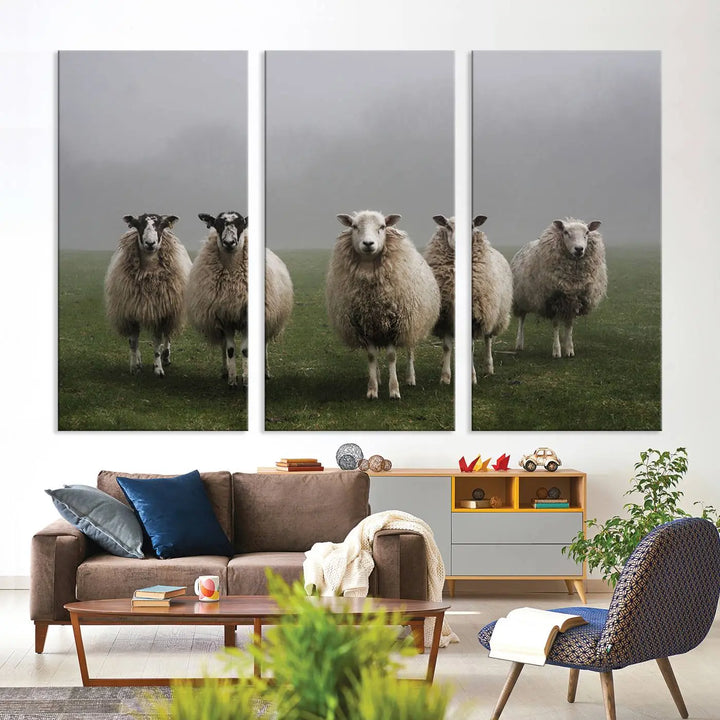 The "Flock of Sheep in a Mystical Fog" pastoral wall art canvas print, framed and ready to hang, adds a touch of farmhouse decor to the room.