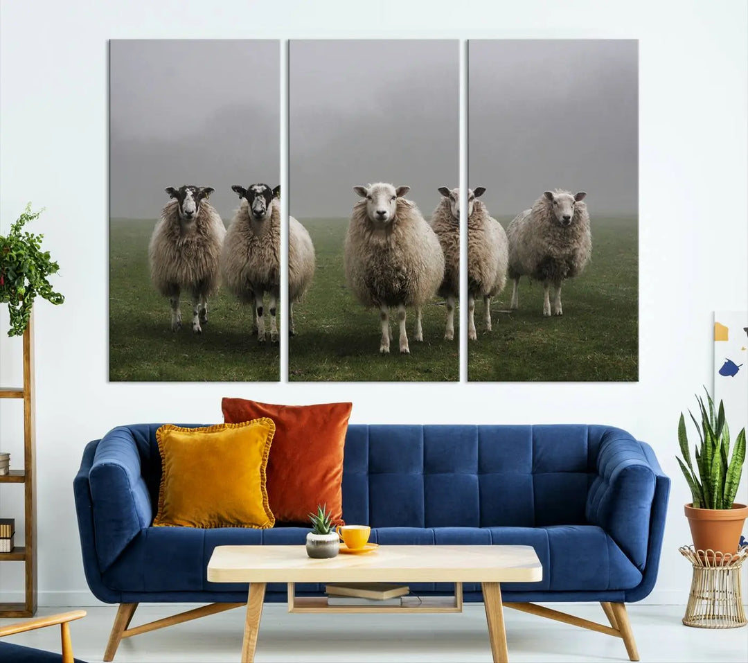 The "Flock of Sheep in a Mystical Fog" pastoral wall art canvas print, framed and ready to hang, adds a touch of farmhouse decor to the room.