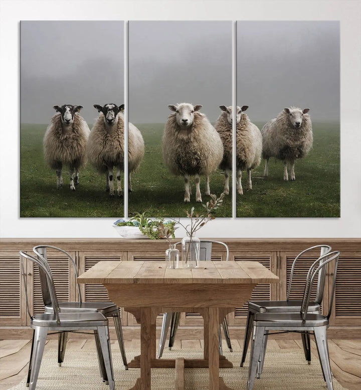 The "Flock of Sheep in a Mystical Fog" pastoral wall art canvas print, framed and ready to hang, adds a touch of farmhouse decor to the room.