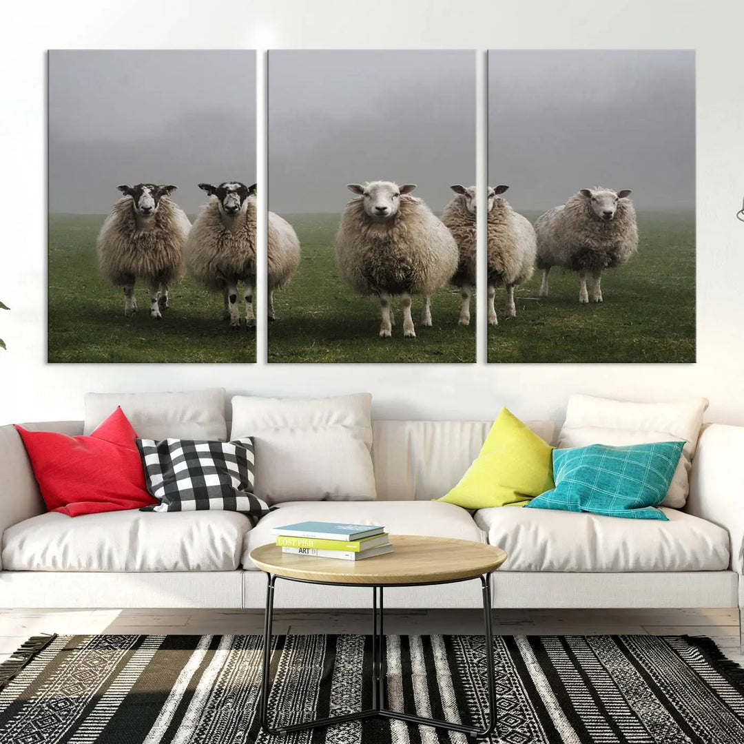 The "Flock of Sheep in a Mystical Fog" pastoral wall art canvas print, framed and ready to hang, adds a touch of farmhouse decor to the room.