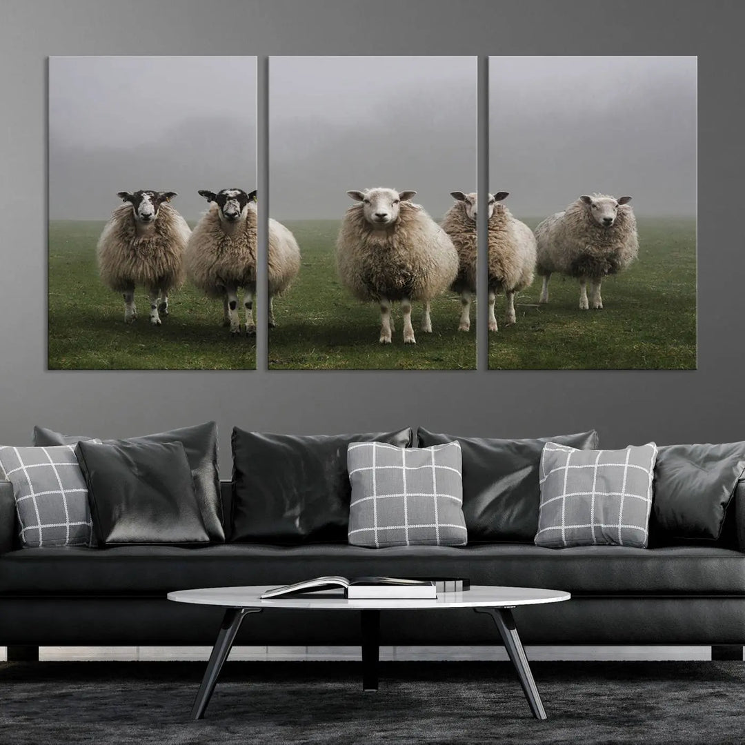 The "Flock of Sheep in a Mystical Fog" pastoral wall art canvas print, framed and ready to hang, adds a touch of farmhouse decor to the room.