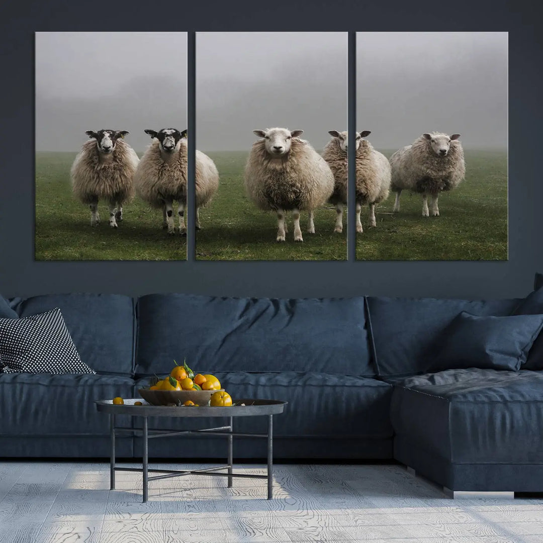 The "Flock of Sheep in a Mystical Fog" pastoral wall art canvas print, framed and ready to hang, adds a touch of farmhouse decor to the room.