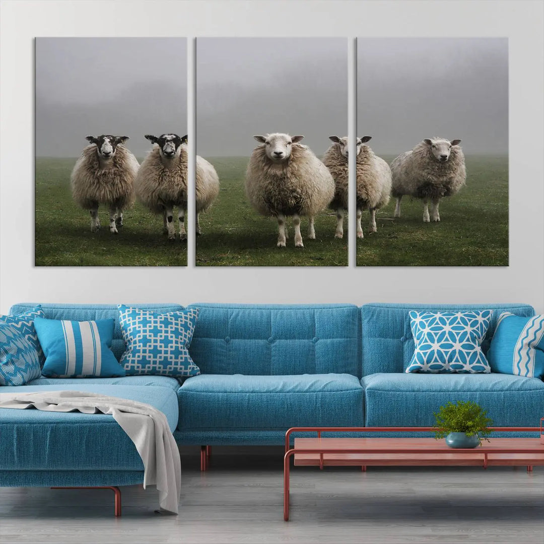 The "Flock of Sheep in a Mystical Fog" pastoral wall art canvas print, framed and ready to hang, adds a touch of farmhouse decor to the room.