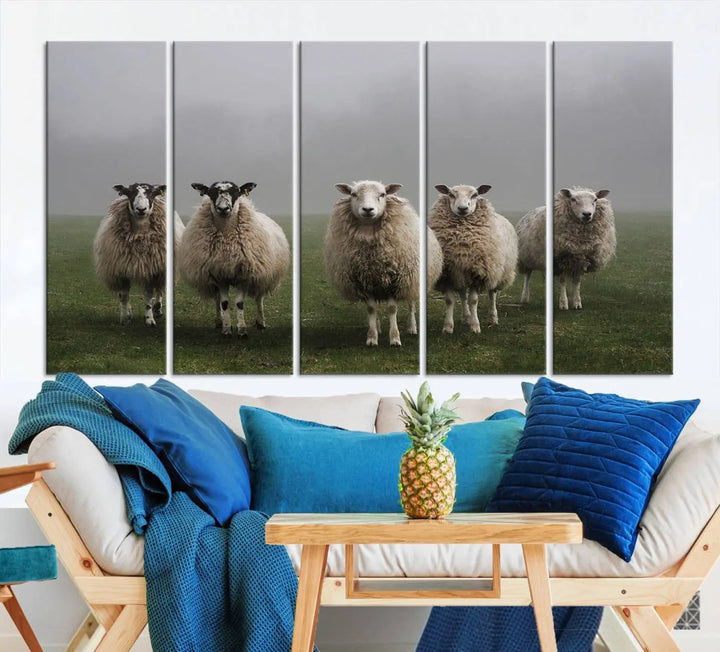 The "Flock of Sheep in a Mystical Fog" pastoral wall art canvas print, framed and ready to hang, adds a touch of farmhouse decor to the room.