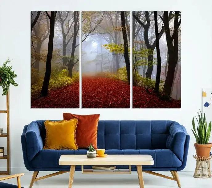 The Foggy Forest Wall Art Landscape Canvas Print beautifully enhances the space. This triptych artwork showcases a misty autumn forest with a red-leafed path, presented on museum-quality canvases with UV-protective coating for enduring allure. Enjoy the added benefit of free shipping on your purchase.