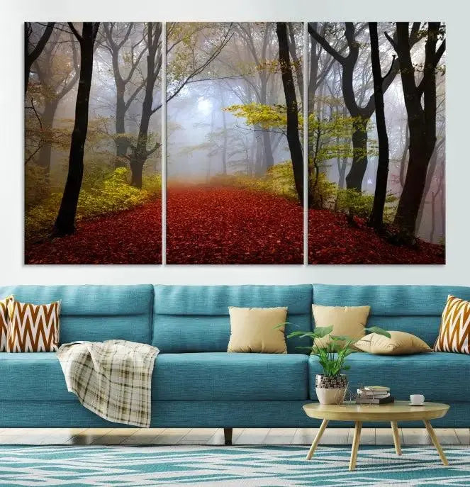 The Foggy Forest Wall Art Landscape Canvas Print beautifully enhances the space. This triptych artwork showcases a misty autumn forest with a red-leafed path, presented on museum-quality canvases with UV-protective coating for enduring allure. Enjoy the added benefit of free shipping on your purchase.