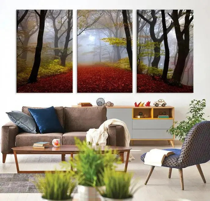 The Foggy Forest Wall Art Landscape Canvas Print beautifully enhances the space. This triptych artwork showcases a misty autumn forest with a red-leafed path, presented on museum-quality canvases with UV-protective coating for enduring allure. Enjoy the added benefit of free shipping on your purchase.