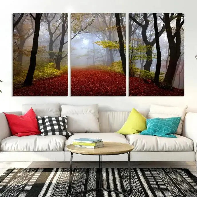 The Foggy Forest Wall Art Landscape Canvas Print beautifully enhances the space. This triptych artwork showcases a misty autumn forest with a red-leafed path, presented on museum-quality canvases with UV-protective coating for enduring allure. Enjoy the added benefit of free shipping on your purchase.