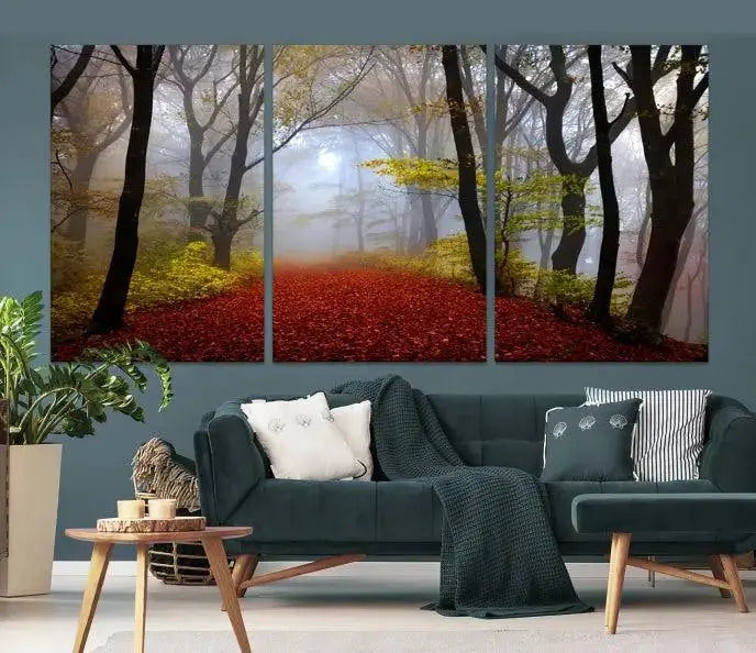 The Foggy Forest Wall Art Landscape Canvas Print beautifully enhances the space. This triptych artwork showcases a misty autumn forest with a red-leafed path, presented on museum-quality canvases with UV-protective coating for enduring allure. Enjoy the added benefit of free shipping on your purchase.