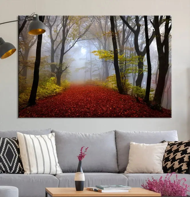 The Foggy Forest Wall Art Landscape Canvas Print beautifully enhances the space. This triptych artwork showcases a misty autumn forest with a red-leafed path, presented on museum-quality canvases with UV-protective coating for enduring allure. Enjoy the added benefit of free shipping on your purchase.