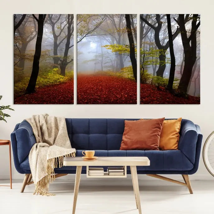 The Foggy Forest Wall Art Landscape Canvas Print beautifully enhances the space. This triptych artwork showcases a misty autumn forest with a red-leafed path, presented on museum-quality canvases with UV-protective coating for enduring allure. Enjoy the added benefit of free shipping on your purchase.