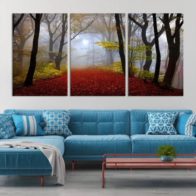 The Foggy Forest Wall Art Landscape Canvas Print beautifully enhances the space. This triptych artwork showcases a misty autumn forest with a red-leafed path, presented on museum-quality canvases with UV-protective coating for enduring allure. Enjoy the added benefit of free shipping on your purchase.