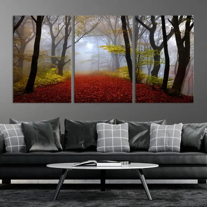 The Foggy Forest Wall Art Landscape Canvas Print beautifully enhances the space. This triptych artwork showcases a misty autumn forest with a red-leafed path, presented on museum-quality canvases with UV-protective coating for enduring allure. Enjoy the added benefit of free shipping on your purchase.