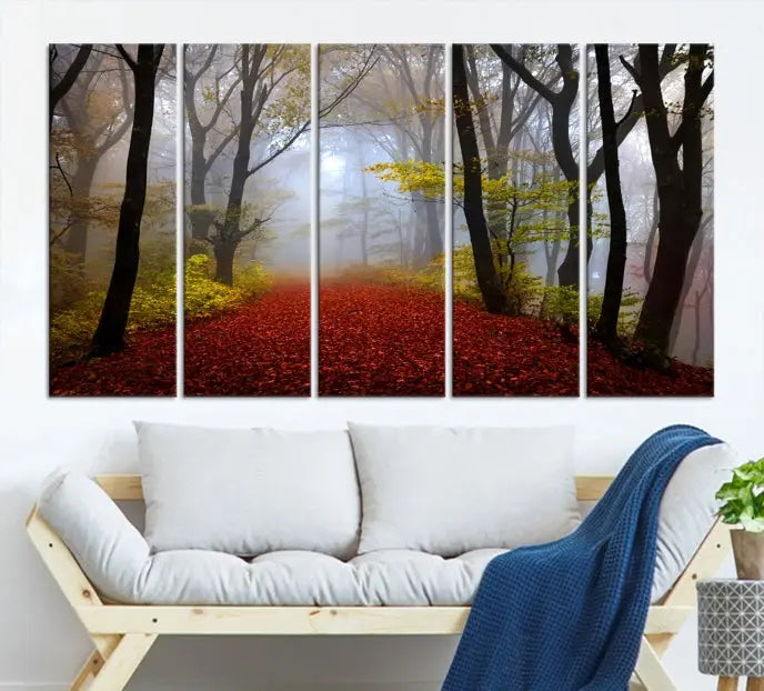 The Foggy Forest Wall Art Landscape Canvas Print beautifully enhances the space. This triptych artwork showcases a misty autumn forest with a red-leafed path, presented on museum-quality canvases with UV-protective coating for enduring allure. Enjoy the added benefit of free shipping on your purchase.