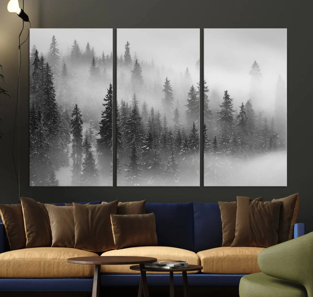 The living room showcases the Foggy Misty Forest Canvas Wall Art in black and white, presented as a triptych on the wall.